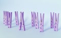Unique, individuality, outstanding,leadership and think different concept. Purple wooden clip stand out of other clips