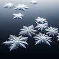 Unique intricate snowflakes are arranged on a glossy dark surface Royalty Free Stock Photo