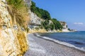 Limestone cliffs above a shore of flints Royalty Free Stock Photo