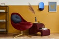 Unique living room in modern style interior with mock up poster frame,  design red velvet armchair,  elegant furniture, decoration Royalty Free Stock Photo