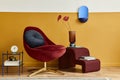 Unique living room in modern style interior with mock up poster frame, design red velvet armchair, elegant furniture, decoration Royalty Free Stock Photo