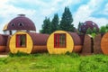 Unique lodgings blend in with nature. Eco housing. House-barrel outdoors.