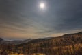 Unique moment. Mountain landscape under full solar eclipse