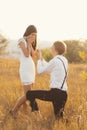 The Unique moment in their life, young man standing at his knee