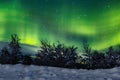 A unique natural event of the green polar aurora borealis in the night sky Royalty Free Stock Photo