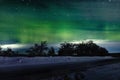 A unique natural phenomenon of the green polar northern lights in the night sky Royalty Free Stock Photo