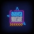 Order Here Neon Signboard On Brick Wall Royalty Free Stock Photo