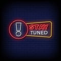 Neon Sign stay tuned with brick wall background vector Royalty Free Stock Photo