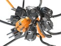 Unique orange electric plug in the heap of a black plugs. Leadership, competition, unique and unicity concept