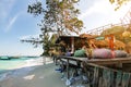 Unique party beach bar restaurant at beautiful Thailand travel island `Koh Lipe` white sand beach and turquoise sea water with sun