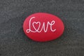 Love text on a red colored stone Royalty Free Stock Photo