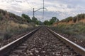 Unique railroad line at the sunset. Train railway track . Low clouds over the railroad