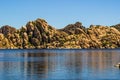 Unique Rocky Boulder Shoreline Of Lake In Desert Foothills Royalty Free Stock Photo