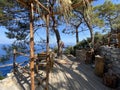 Wooden natural seats and desk with sea view. Royalty Free Stock Photo