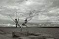 Unique sculpture `Fishermen` with geometrical figure of a metal fishing network