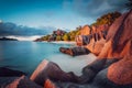Unique shaped granite boulders and a dramatic sunset at Anse Source d`Argent beach, La Digue island, Seychelles. Long Royalty Free Stock Photo