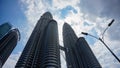 Unique shot of twin tower with clean blue sky at afternoon