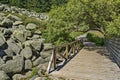 Unique stone river big granite stones on rocky river with wooden bridge in the Vitosha National Park Mountain Royalty Free Stock Photo