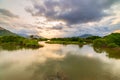 Unique sunset sky in Vietnam beautiful Phu Yen province Cam Lap promontory forest hill river ecosystem water reflection colorful Royalty Free Stock Photo