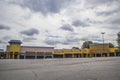 Unique vacant retail strip mall on a cloudy day