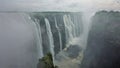 Unique Victoria Falls. Streams of water rush down from the edge of the gorge. Royalty Free Stock Photo