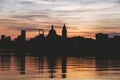 Mantova silhouette reflected in Mincio lake at sunset, Lombardia