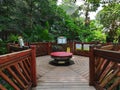 Unique wooden garden benches and fence inside the Hong Kong Park aviary Royalty Free Stock Photo