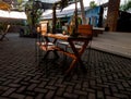 Outdoor restaurant coffee open air cafe chairs with table. In sun set Royalty Free Stock Photo