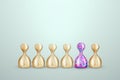 Uniqueness, among the wooden pawns there is a multi-colored pawn. Competitive advantage, standing out from the crowd, thinking Royalty Free Stock Photo