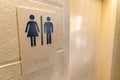 Unisex Bathroom sign with both male and female symbols Royalty Free Stock Photo