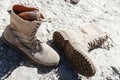 Unisex beige boots with laces and sole on a solid background Royalty Free Stock Photo