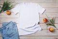 Unisex T-shirt mockup with grass and apples