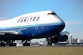 United Airlines Boeing 747 on runway.