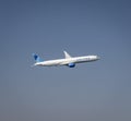 United Airlines Boeing 777 jet flying over San Francisco in Northern California Royalty Free Stock Photo