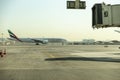 Emirates Airline Airplane getting ready for takeoff at Dubai airport with sky bridge in Royalty Free Stock Photo