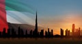 United Arab Emirates flag and Dubai skyline view at sunset. UAE celebration. Royalty Free Stock Photo