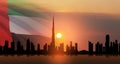 United Arab Emirates flag and Dubai skyline view at sunset. UAE celebration. Royalty Free Stock Photo