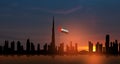 United Arab Emirates flag and Dubai skyline view at sunset. UAE celebration. Royalty Free Stock Photo