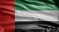 United Arab Emirates flag waving in the wind. Closeup of UAE banner blowing silk Royalty Free Stock Photo