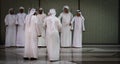 United Arab Emirates Men performing the Yowla dance which is a traditional Arabic dance - Middle Eastern culture