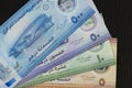 United Arab Emirates new polymer banknotes of 500, 50, 10 and 5 dirhams on black bakcground Royalty Free Stock Photo