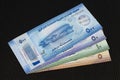 United Arab Emirates new polymer banknotes of 5, 10, 50 and 500 dirhams on black bakcground Royalty Free Stock Photo