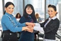 United busienss women with hands together Royalty Free Stock Photo
