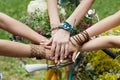 United hands of girlfriends closeup, young girls in boho bracelets Royalty Free Stock Photo