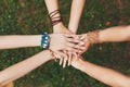 United hands of girlfriends closeup, young girls in boho bracelets Royalty Free Stock Photo