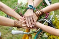 United hands of girlfriends closeup, young girls in boho bracelets Royalty Free Stock Photo