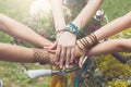 United hands of girlfriends closeup, young girls in boho bracelets Royalty Free Stock Photo