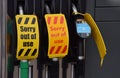 Wiltshire UK. Sept 28 2021. Empty pumps on a petrol station forecourt with a notice that reads `Sorry out of use` as British fuel