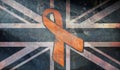 United Kingdom awareness concept. No one fights alone Childhood Cancer awareness month concept with great britain flag and orange
