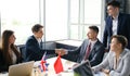 United Kingdom and Chinese leaders shaking hands on a deal agreement. Royalty Free Stock Photo